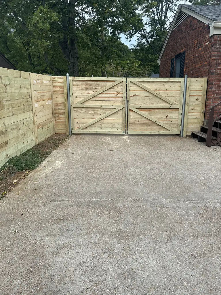 Double wood drive gate across a driveway in Nashville, Tennessee