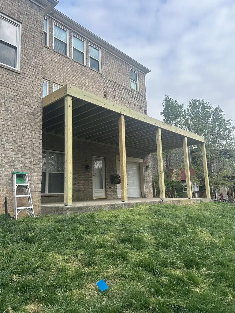 Finished patio cover on timber posts at a brick home in Nashville, Tennessee